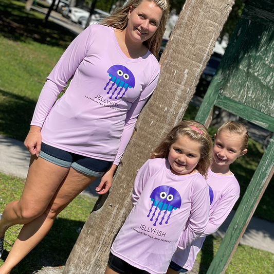 Woman and two girls wearing Lilac Jellyfish Sun Protective Long Sleeve Shirts by ShapeShifter Fish and Friends