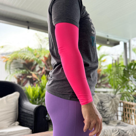 Person wearing a Shecancer Upf Sun Protective Compression Sleeve in an outdoor lifestyle setting