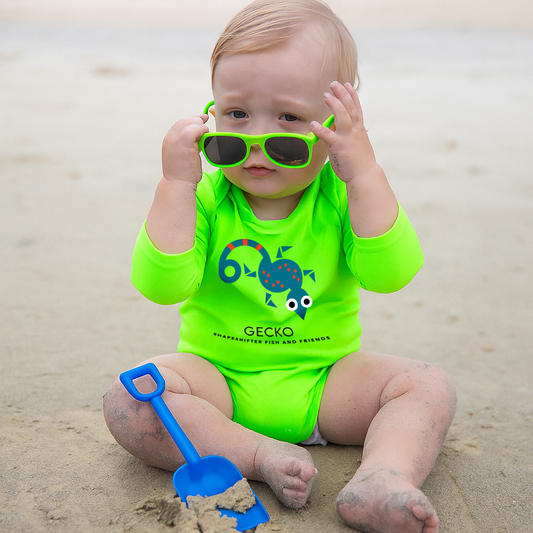 Child wearing a bright green Gecko Upf50 Baby Onesie sun protection by ShapeShifter Fish and Friends lifestyle