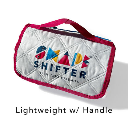 Quilted ShapeShifter Fish and Friends rolled up beach mat with colorful design and  on a white background