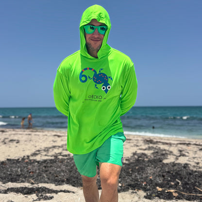 Man wearing a Neon Green Gecko Hooded Sun Protective Long Sleeve Shirt UPF 50+ rashguard by ShapeShifter Fish and Friends on a beach