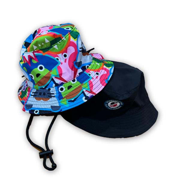 Reversible bucket hats, one with a vibrant multicolored fish and friends print, and the other solid black with a logo on the brim by ShapeShifter Fish and Friends
