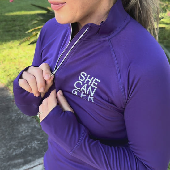 Purple long-sleeve UPF shirt with 'SHE CAN' text, for cancer patients, chemotherapy, radiation